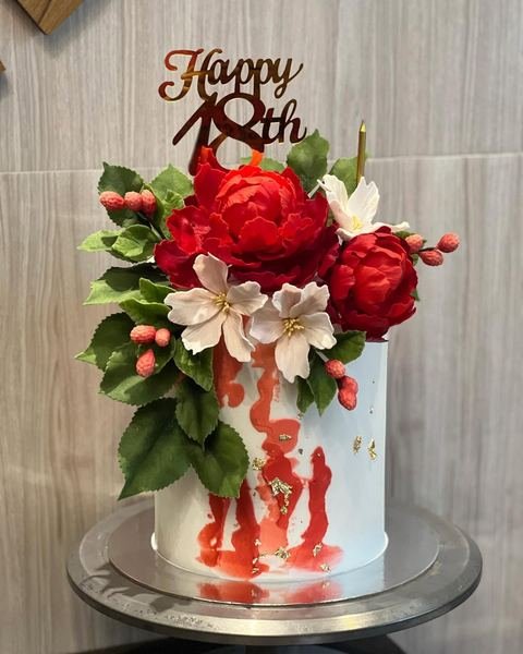 Birthday cake with an 18th red peonies roses theme