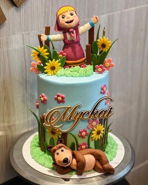 Birthday cake with a bear and girl theme