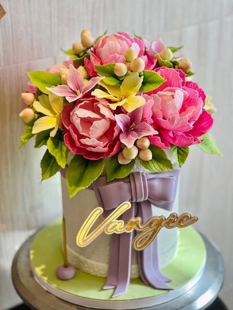 Birthday cake with a bouquet flowers lilies theme