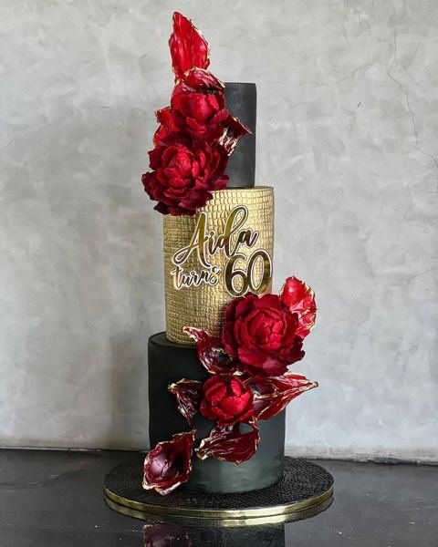Birthday cake with an editorial glamour luxury black red gold theme
