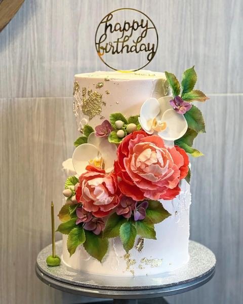 Birthday cake with a peonies floral gold pink theme