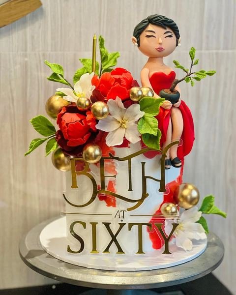 Birthday cake with a floral dahlia jasmine 60th bday theme