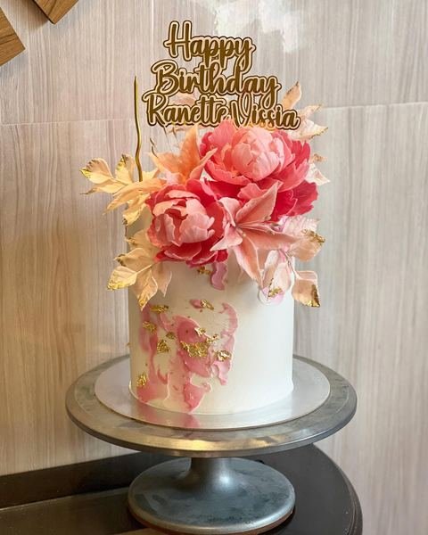 Birthday cake with a floral peonies pink theme