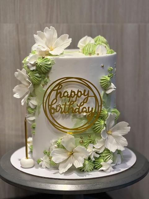 Birthday cake with a green floral theme