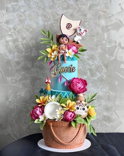 Birthday cake with a mo ana tropical fresh flowers theme
