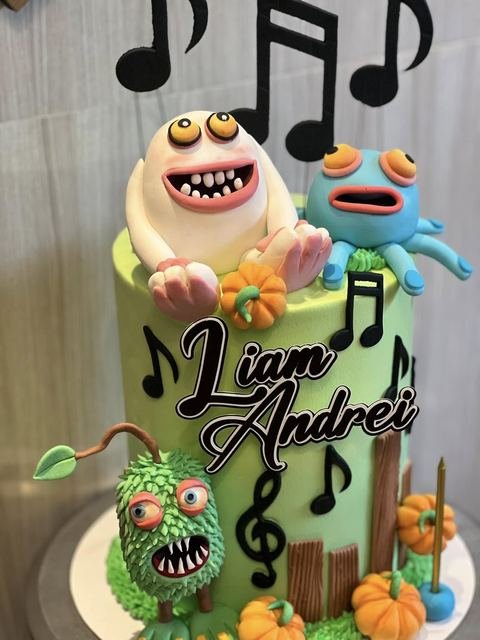 Birthday cake with a singing monsters theme