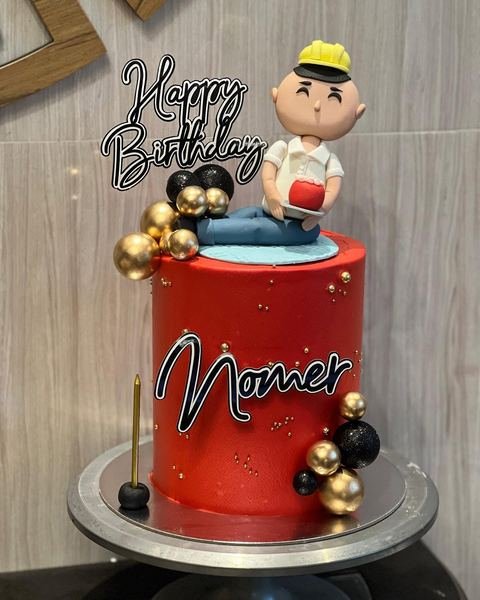 Birthday cake with a builder theme