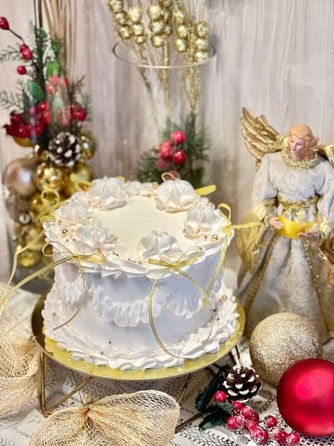 Whipped cream Christmas cake with festive decor