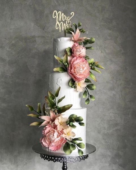 Wedding cake, floral pink peonies jasmine green leaves lilies design