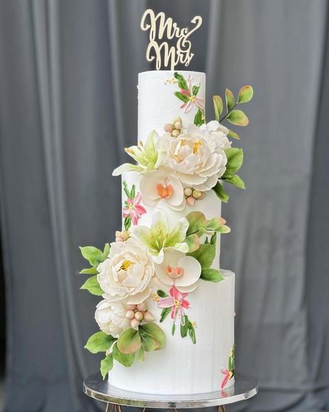 Wedding cake, white peonies orchids floral design