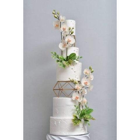 Four tier wedding cake with cascading sugar orchids