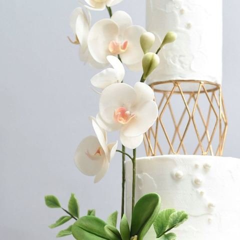 Wedding cake with sugar orchid cascade, side view